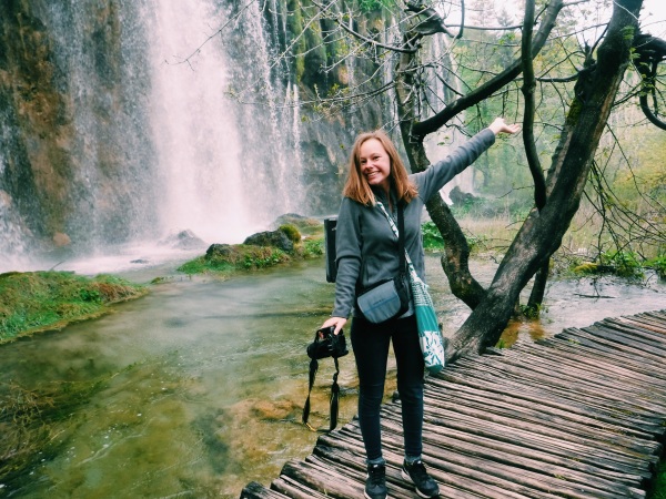 Me standing in front of a waterfall in Croatia